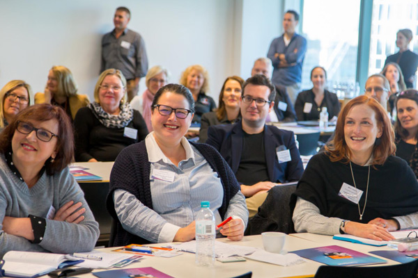 Smiling attendees at WayAhead Workplaces Forum 2018
