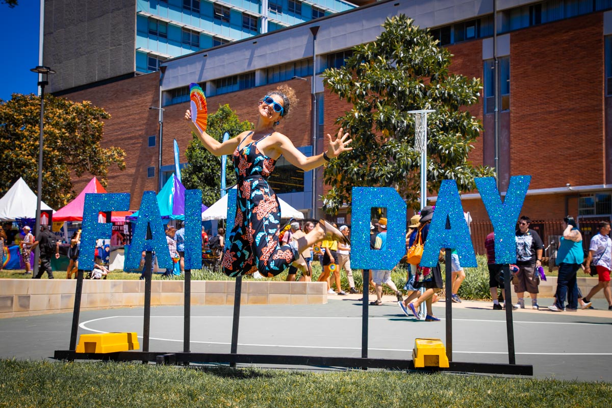 Woman jumping for joy at Fair day