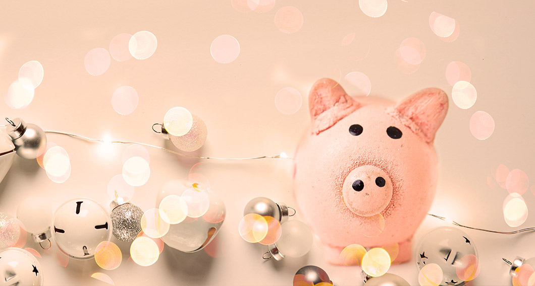 Pig money box surrounded with festive lights